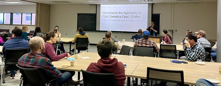 A group of Agronomy and Plant Genetics Department members gather at a social coffee and learn about upcoming DEI programming